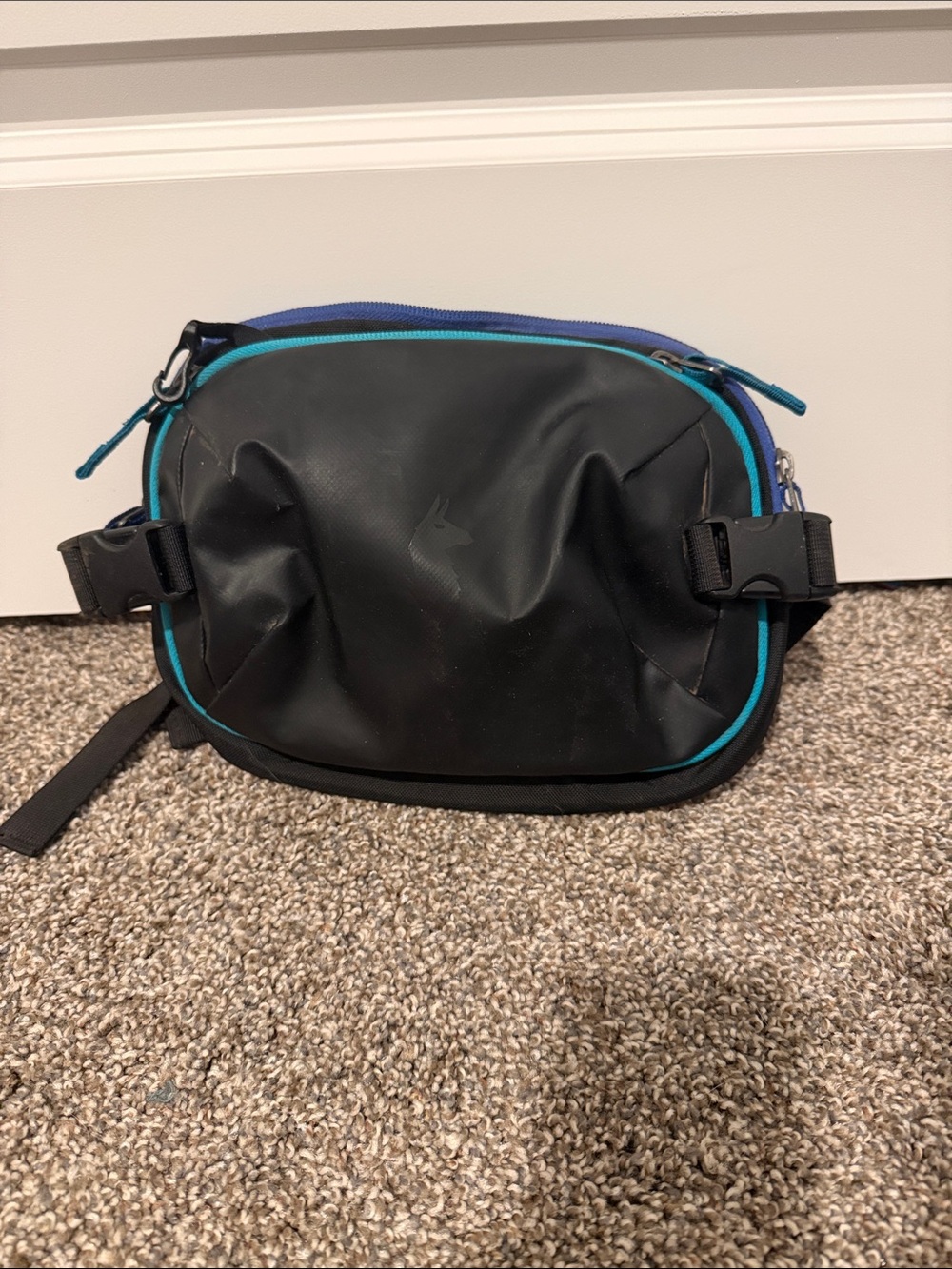 cotopaxi Black Belt Bag with Teal and Blue Zipper Accents